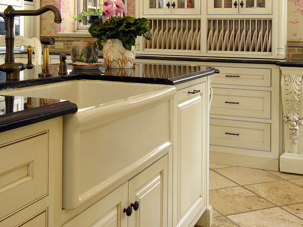 Elegant cream kitchen with dark countertops